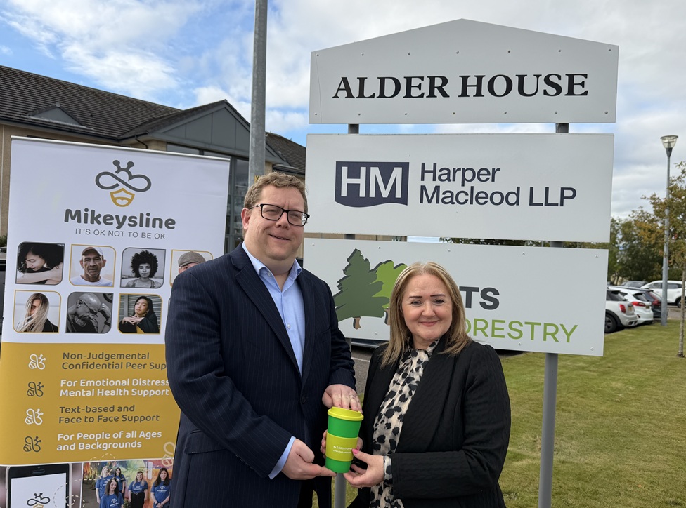 Tulloch Homes passes Cup of Kindness to Harper Macleod after raising over £5,000 for Mikeysline