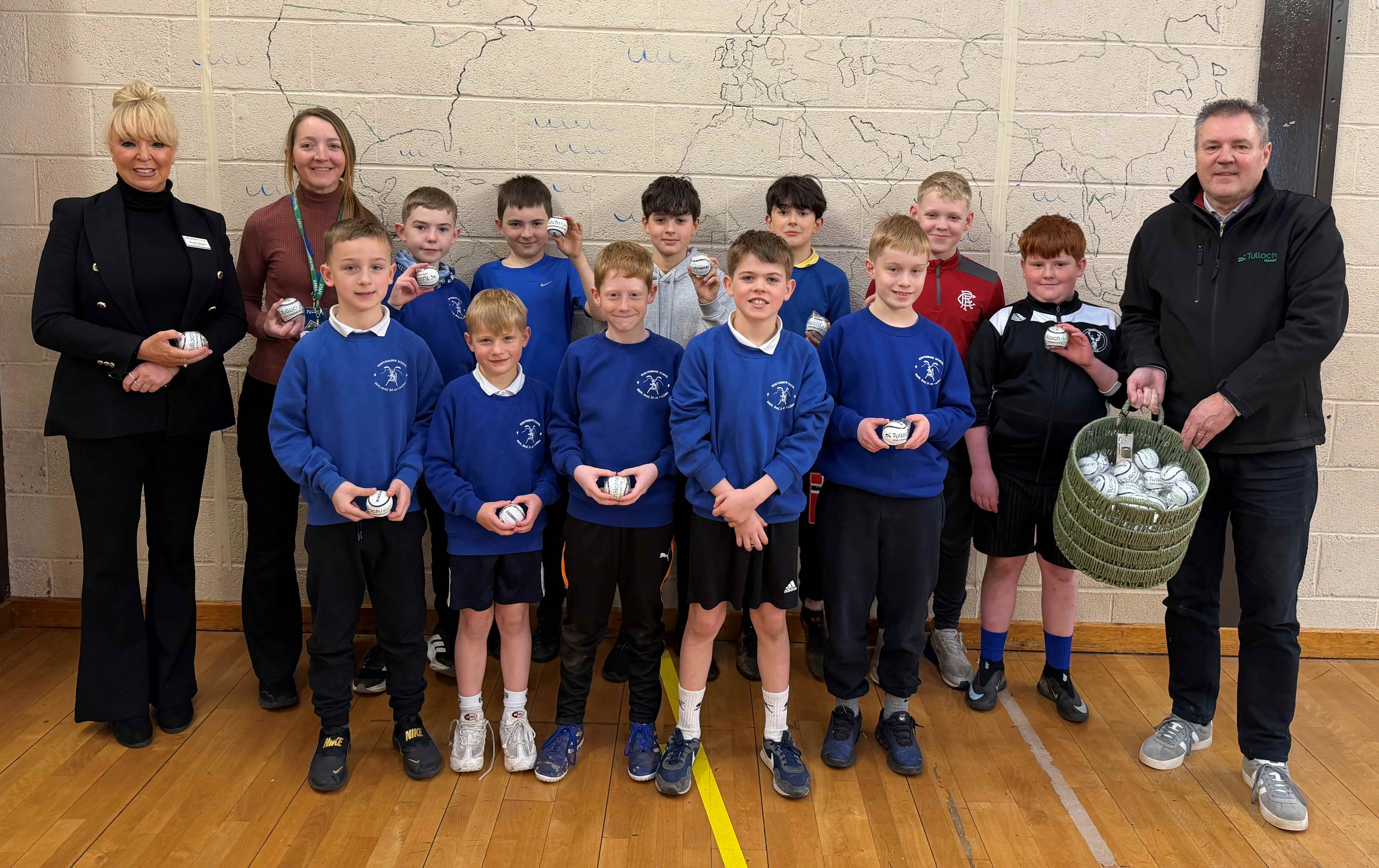Tulloch Homes donates Camanachd Cup Shinty Balls to primary school