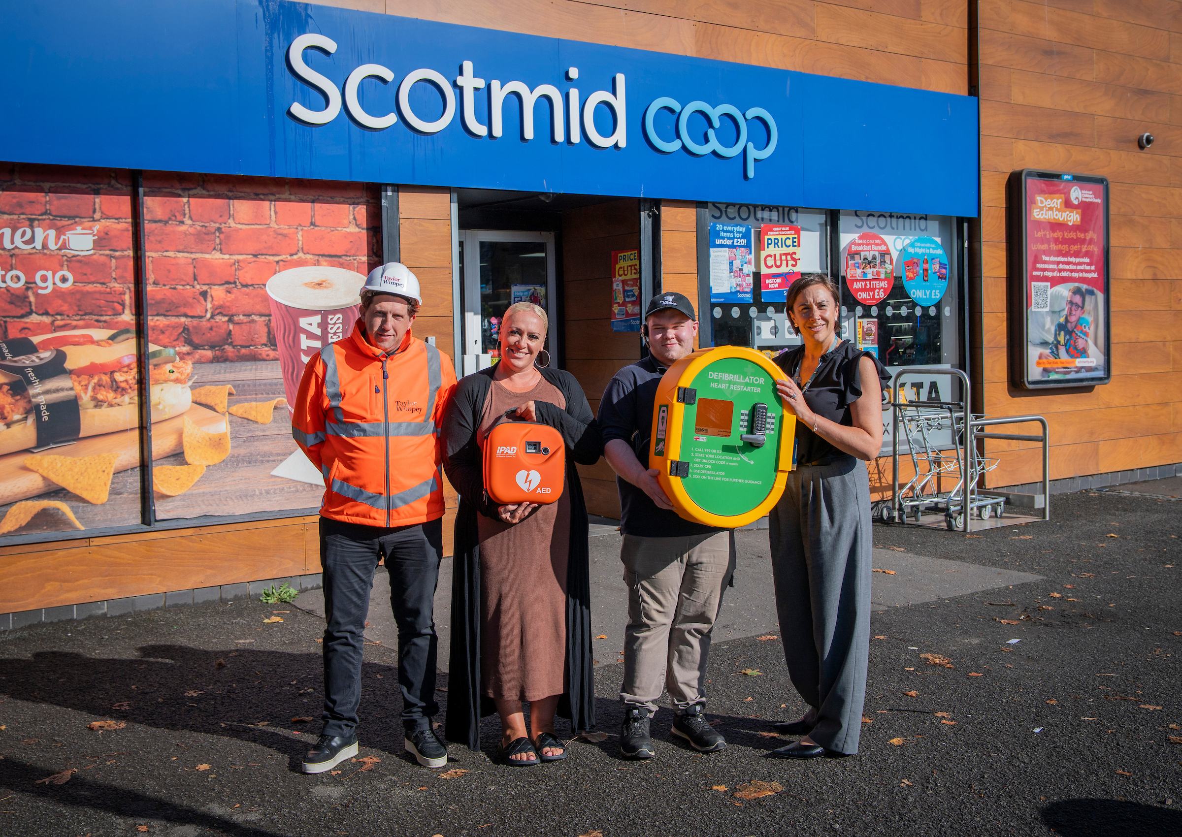 Defibrillator donated by Taylor Wimpey to Ratho Station store