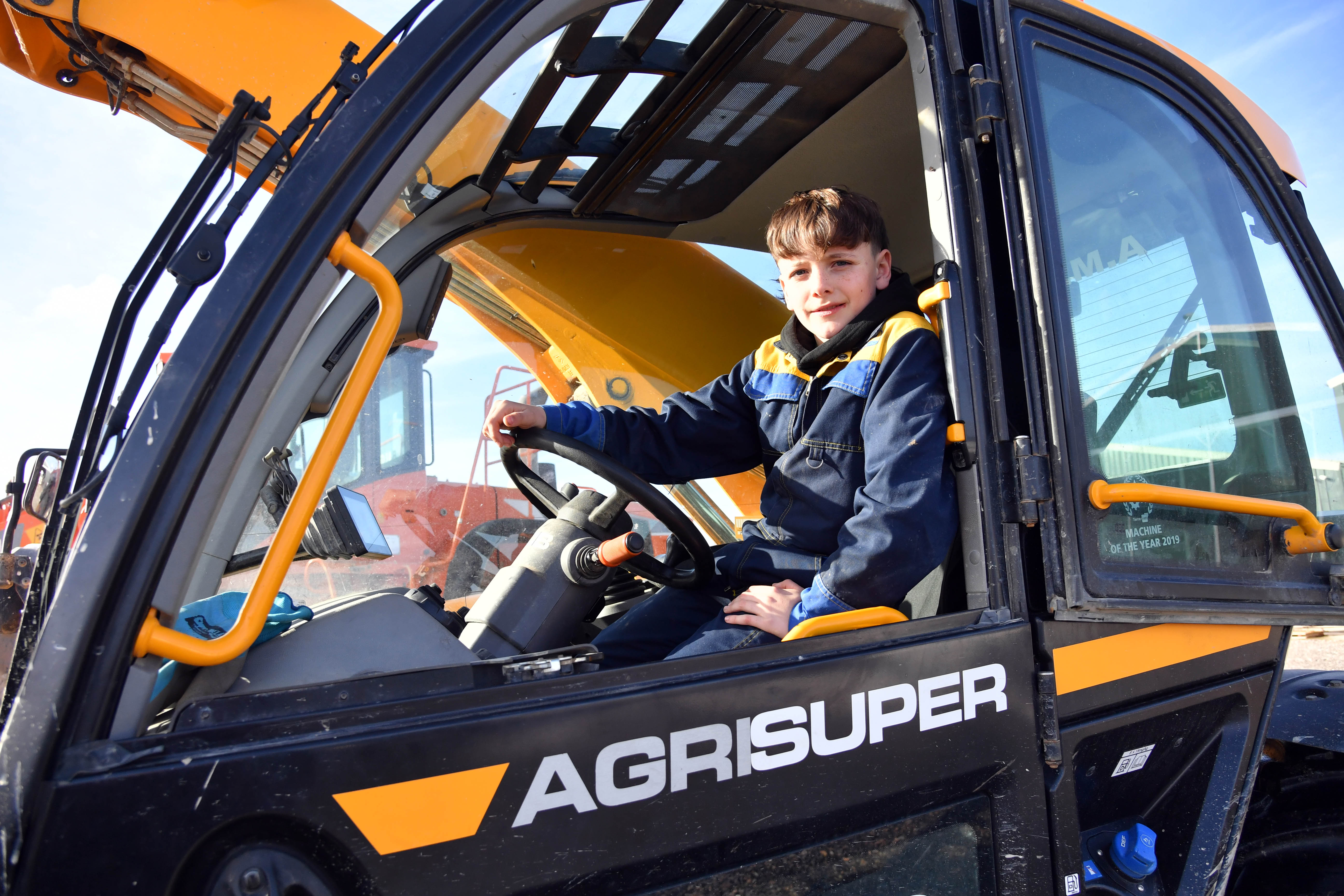 And finally... 13-year-old Jake proves truck driving is child's play