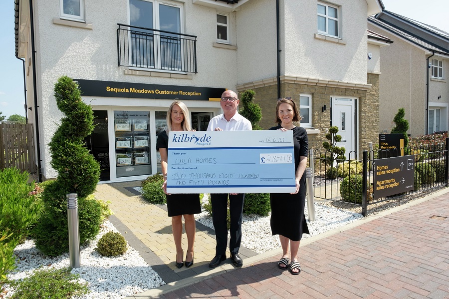 Cala hands over roof donation to Kilbryde Hospice
